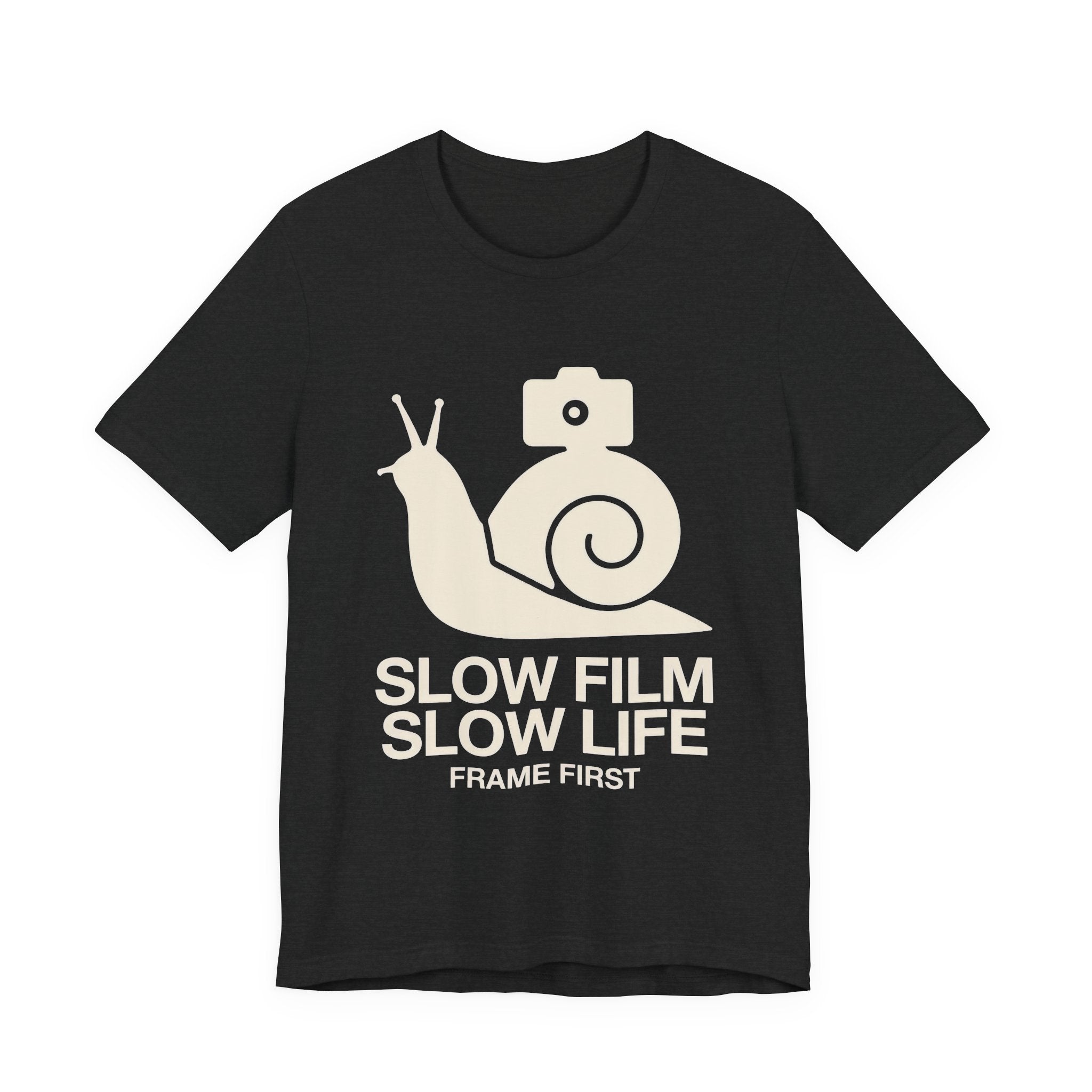 Black t-shirt with a snail and camera graphic and text 'Slow Film Slow Life Frame First' on a white background