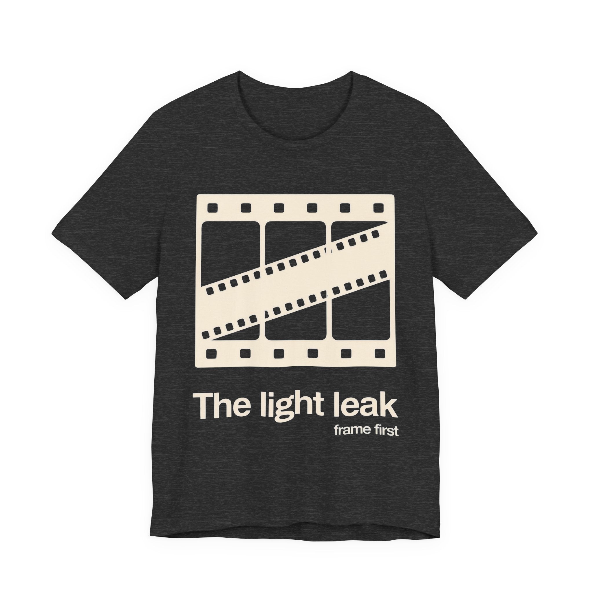 Dark gray t-shirt with a film reel design and white 'The light leak frame first' text on a white background