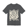 Gray t-shirt with 'Needle Drop' text design on a white background