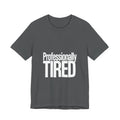 Gray t-shirt with 'Professionally TIRED' text on a white background