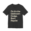 Black t-shirt with white text 'Fix it in the Darkroom Dodge, Burn, Repeat' on a white background