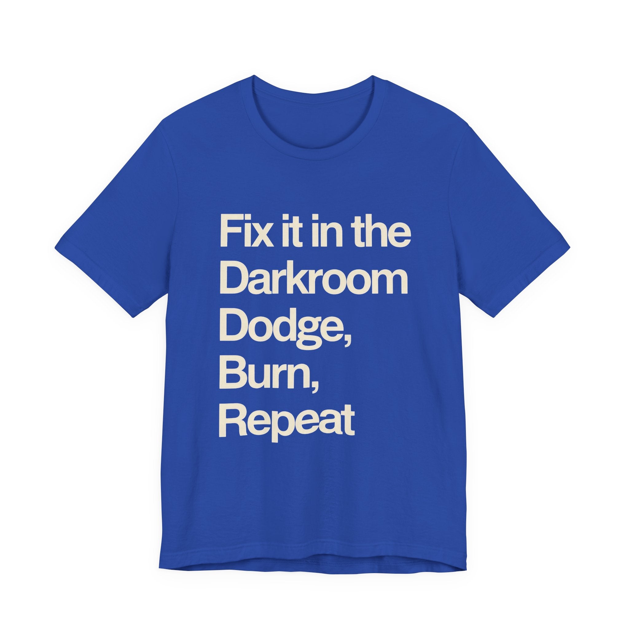 Blue t-shirt with white text 'Fix it in the Darkroom Dodge, Burn, Repeat' on a white background