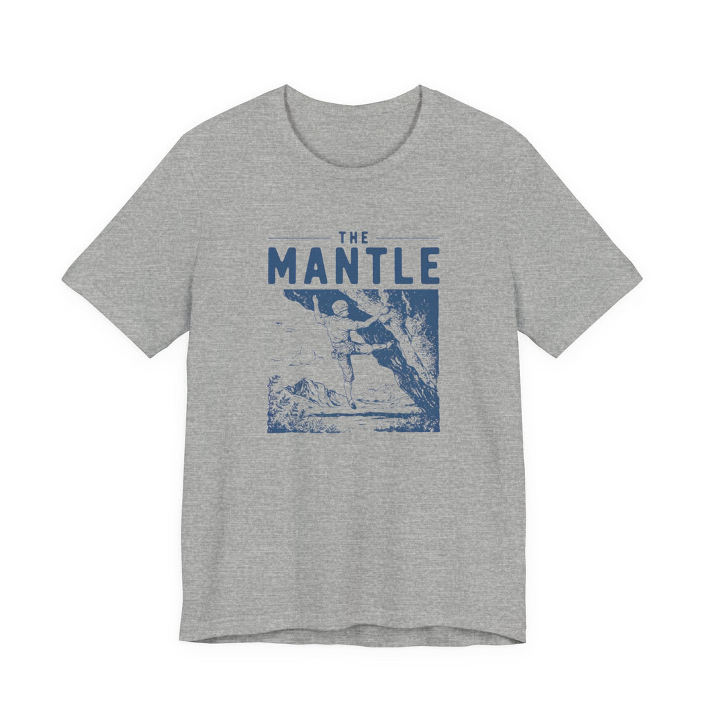Gray t-shirt with blue graphic and 'The Mantle' text on a white background