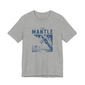 Gray t-shirt with blue graphic and 'The Mantle' text on a white background