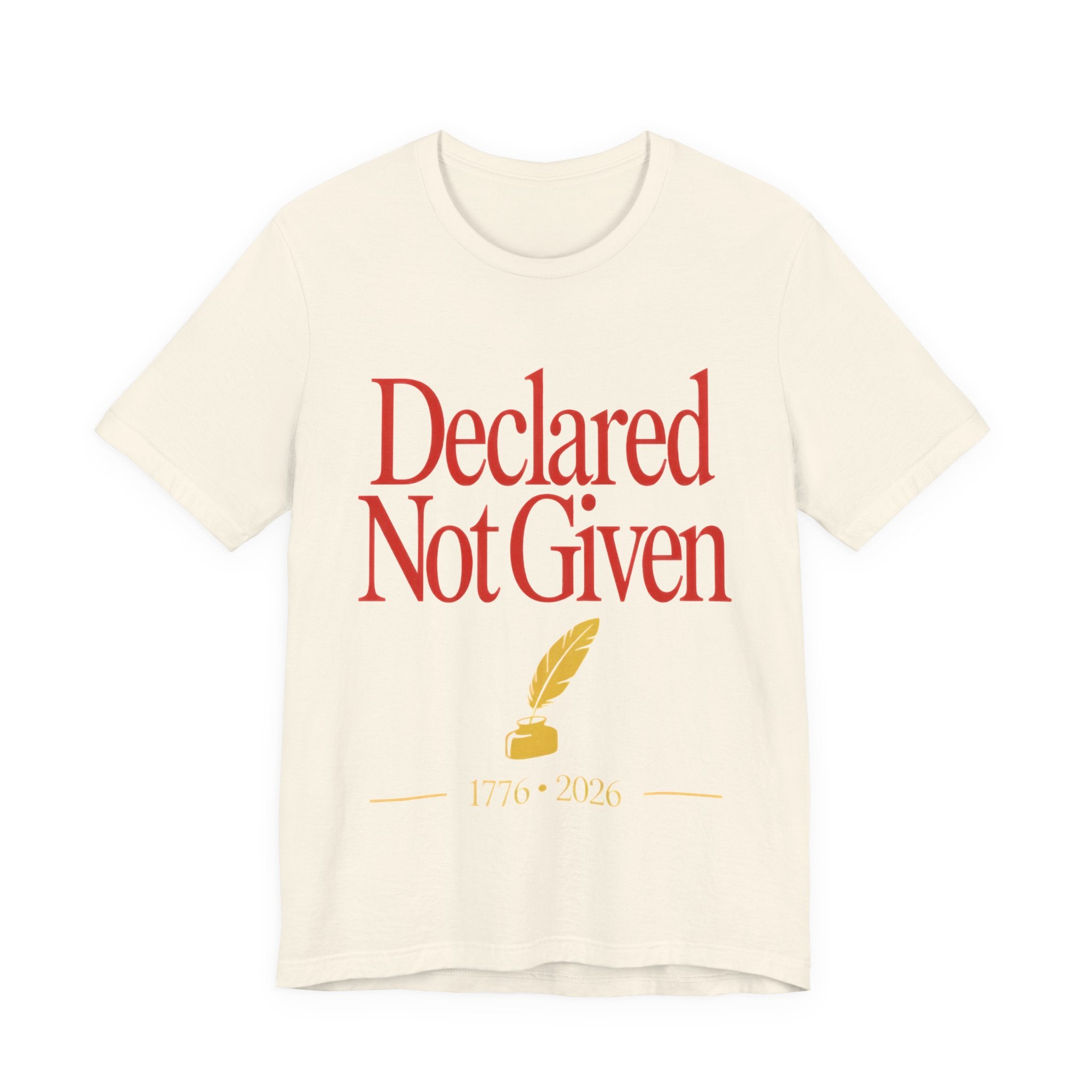 Biege t-shirt with red text 'Declared Not Given' and a yellow feather and inkwell on a white background