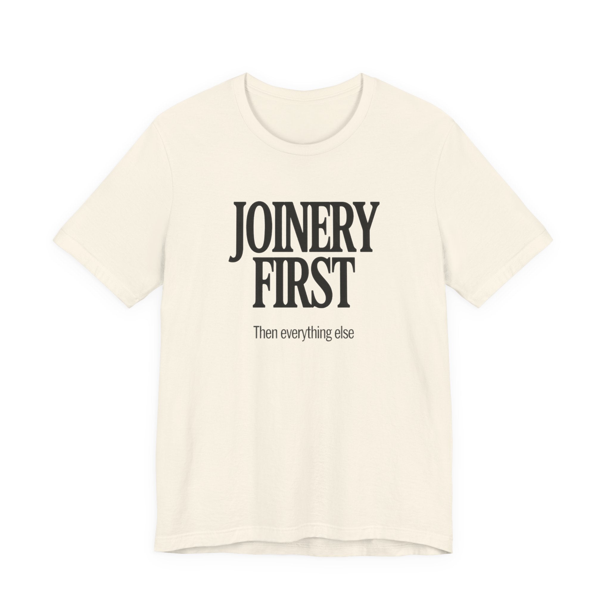 Beige t-shirt with 'JOINERY FIRST, Then everything else' text on a white background