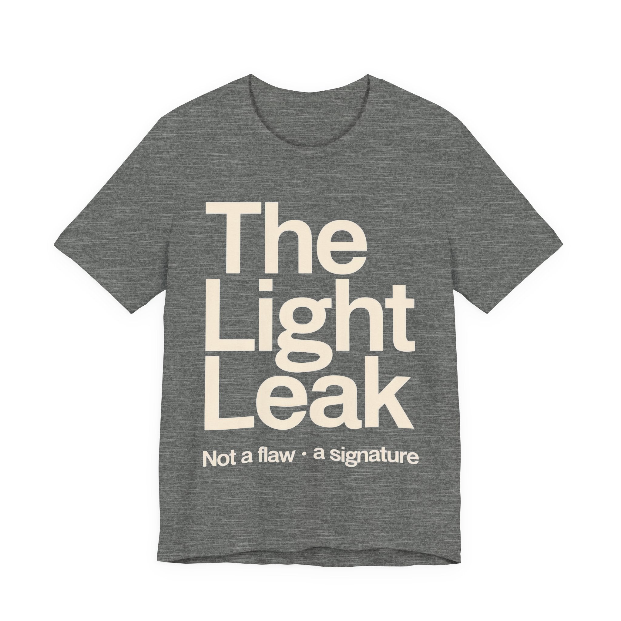 Grey t-shirt with 'The Light Leak Not a flaw, a signature' text on a white background