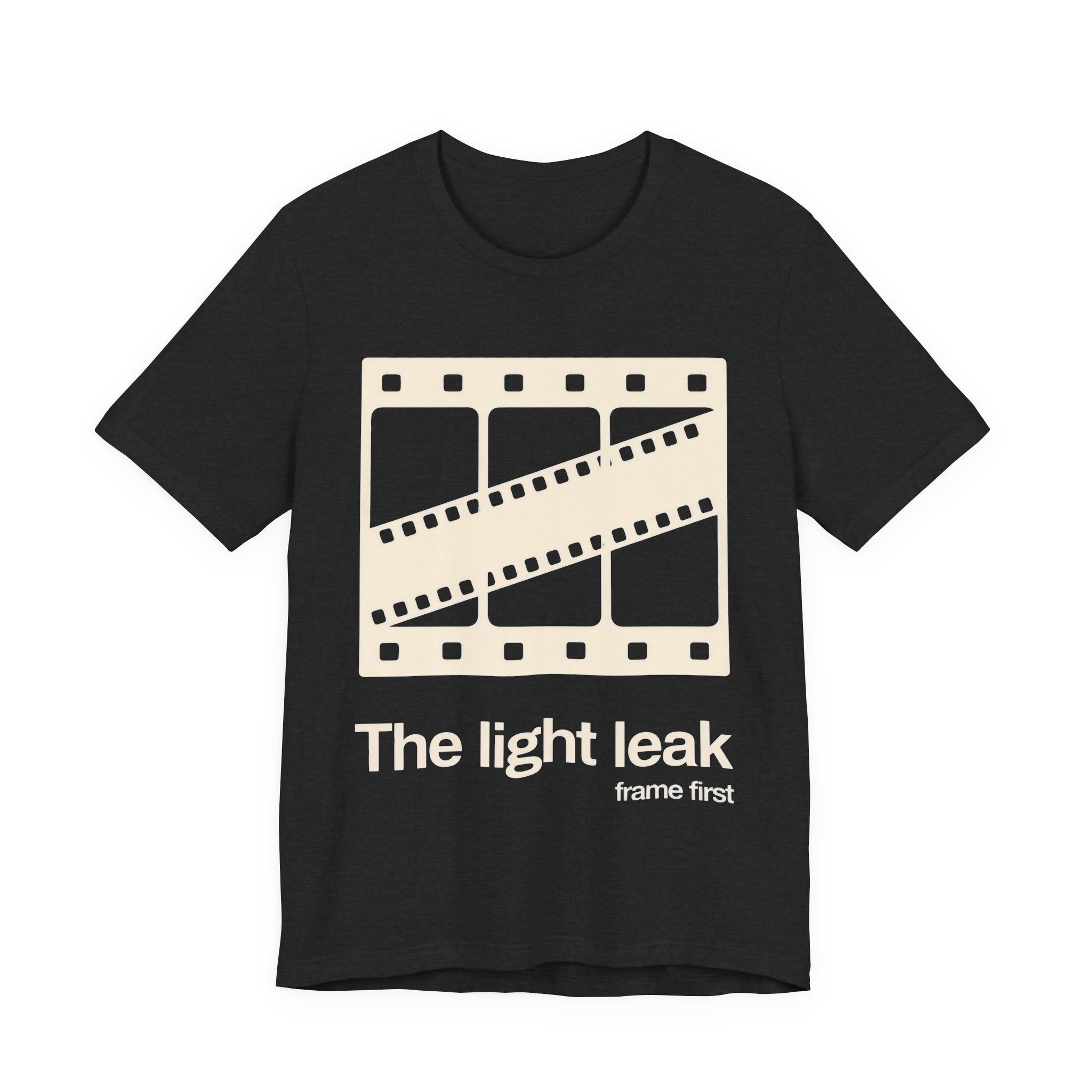 Dark gray t-shirt with a film reel design and white 'The light leak frame first' text on a white background
