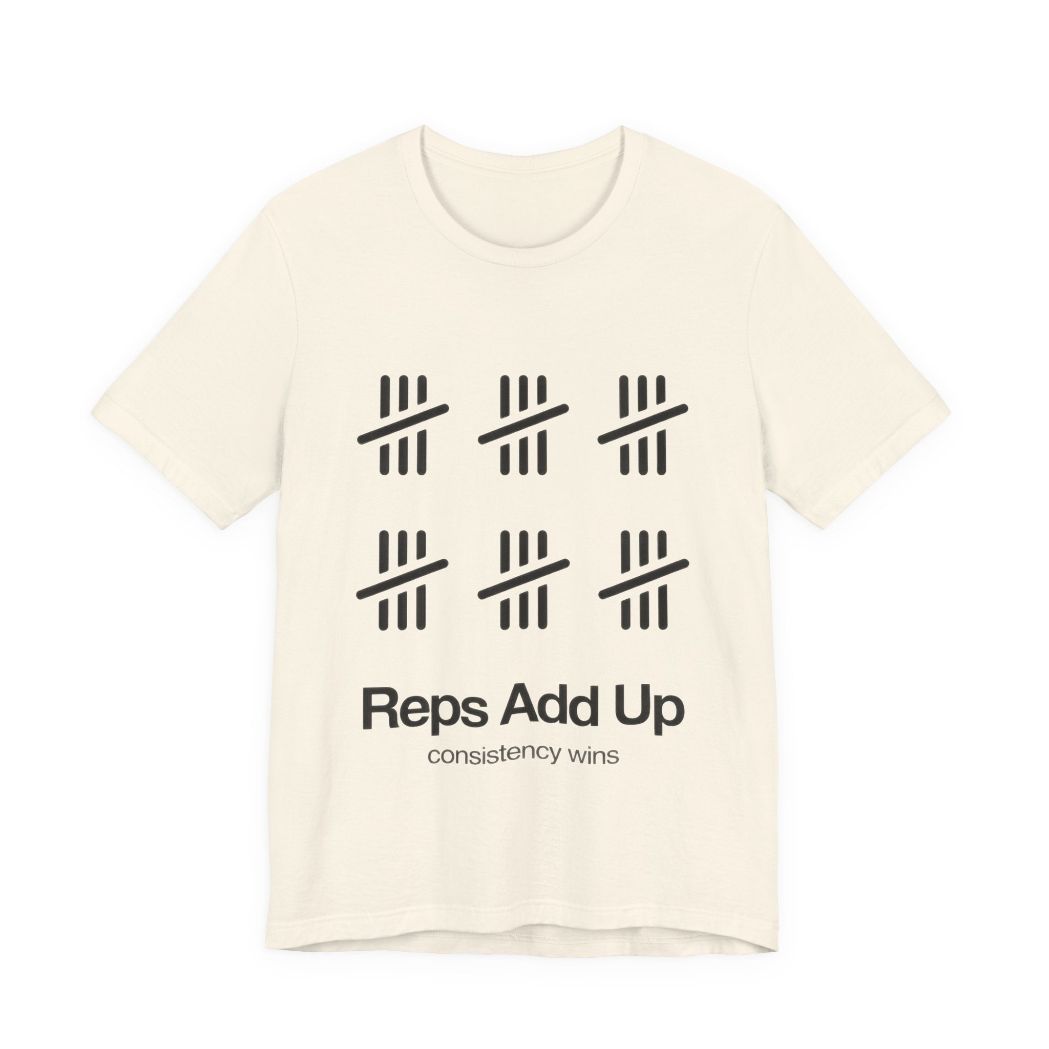 Beige t-shirt with black graphic design and text 'Reps Add Up, consistency wins' on a plain background