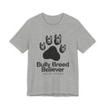 Gray t-shirt with graphic of dog heads and text 'Bully Breed Believer' on a white background