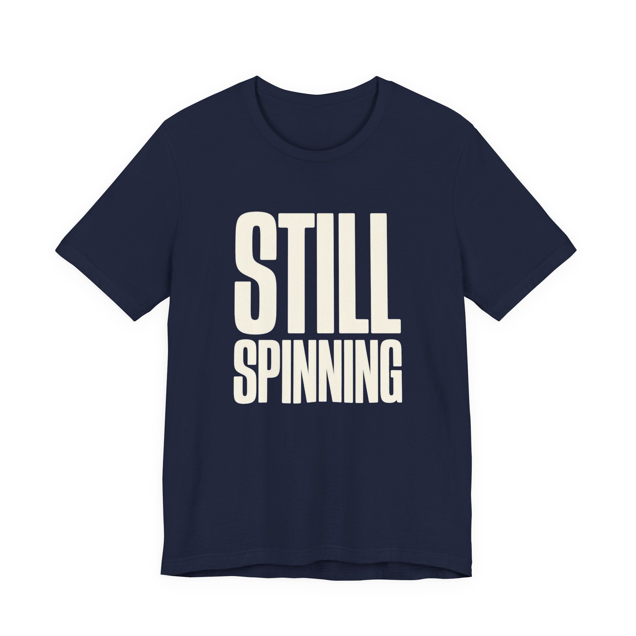 Navy blue t-shirt with 'STILL SPINNING' text on a white background