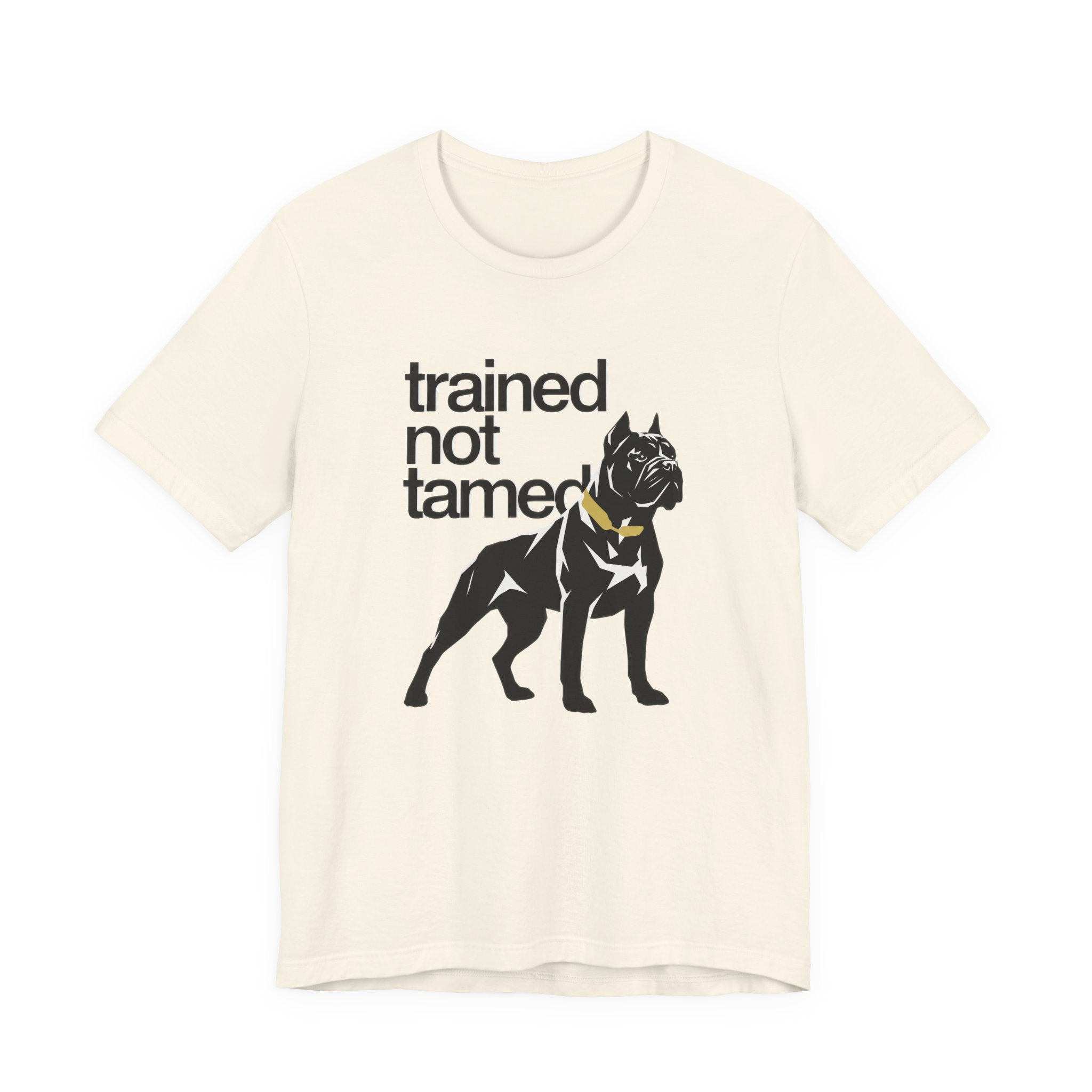 Beige t-shirt with black dog graphic and text 'trained not tamed' on a white background