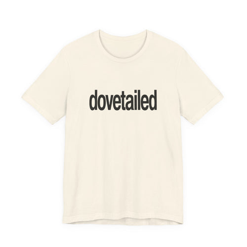Beige t-shirt with 'dovetailed' text on a white background