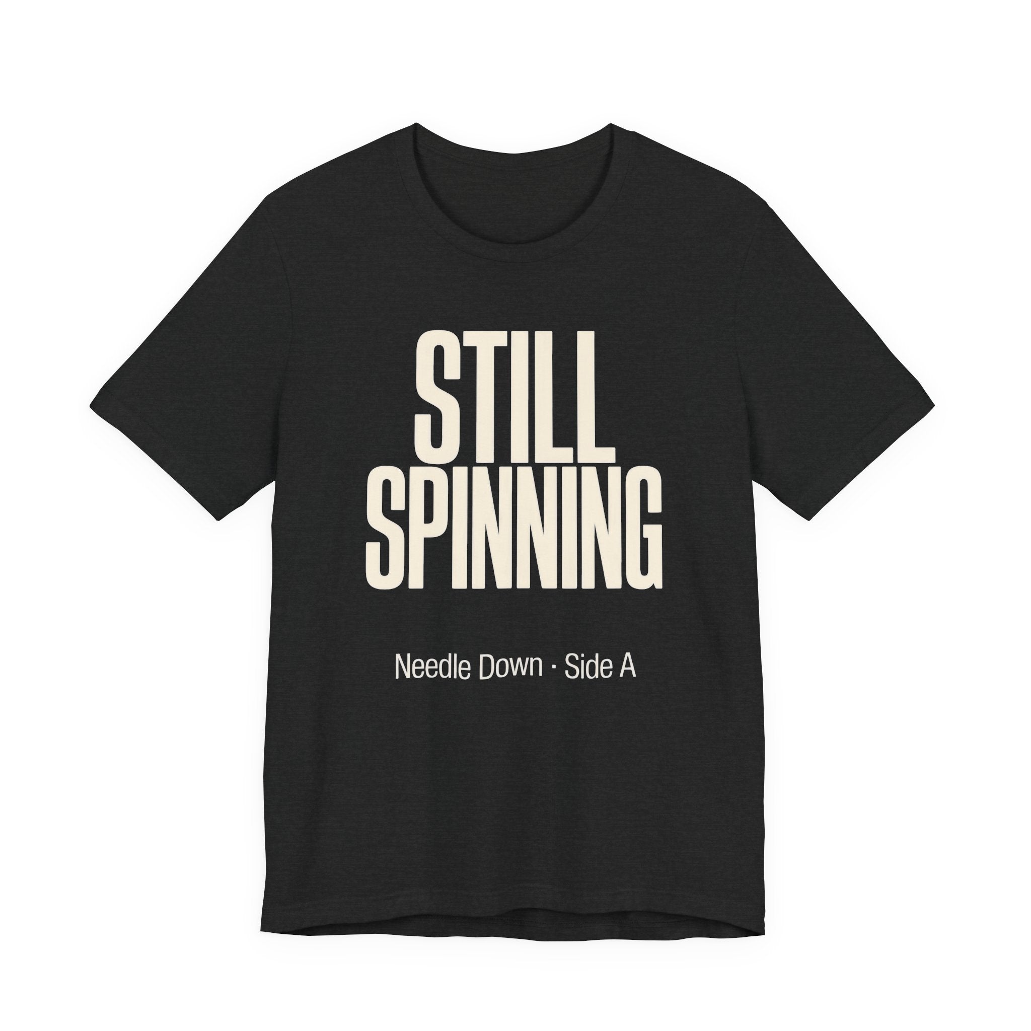 Black t-shirt with 'STILL SPINNING' text on a white background