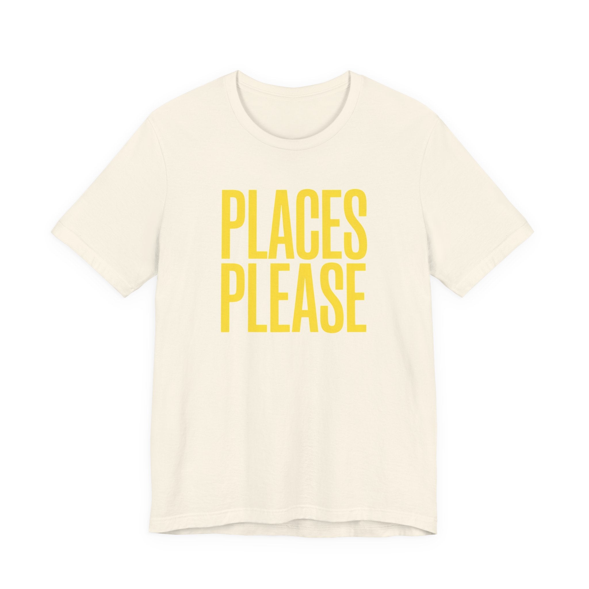 Beige t-shirt with 'PLACES PLEASE' text in yellow on a white background