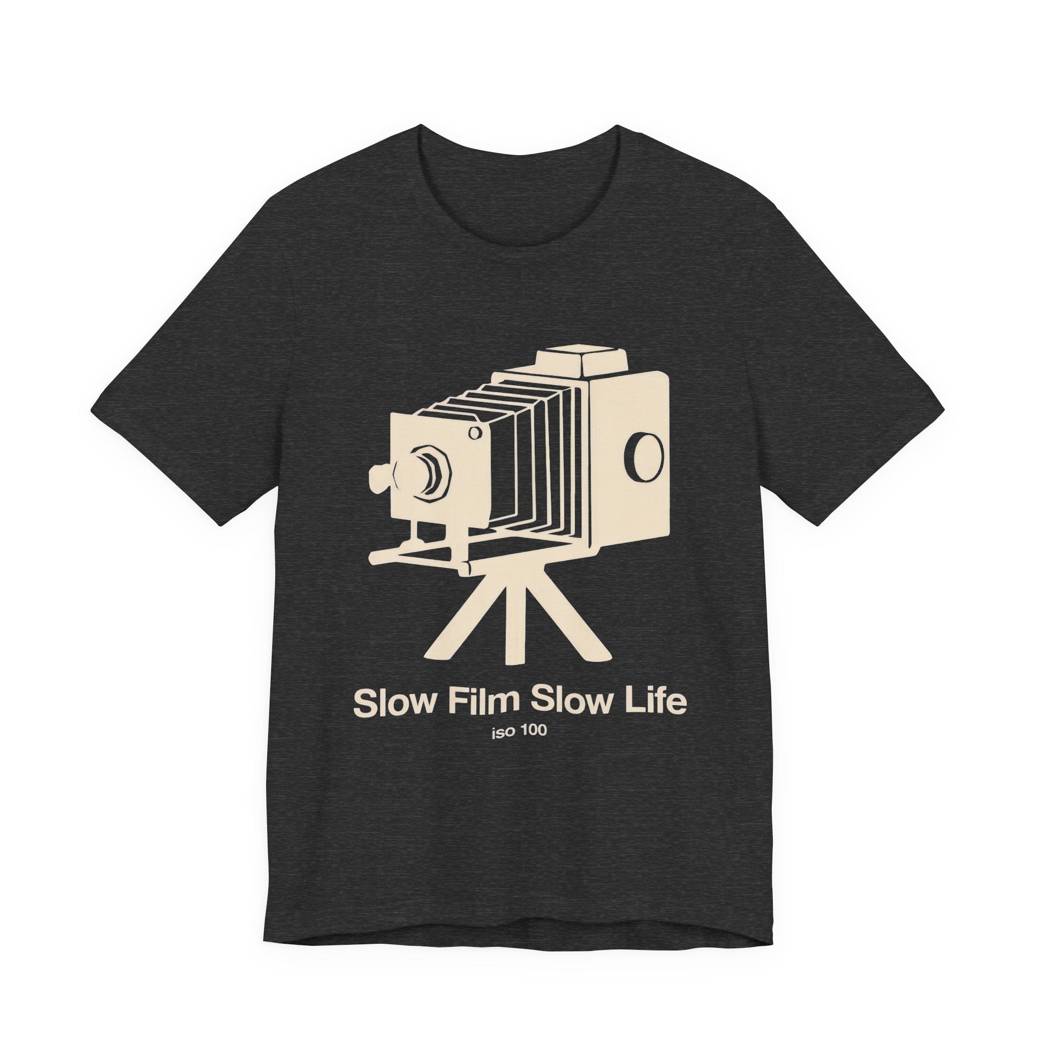 Dark gray t-shirt with a vintage camera graphic and 'SLOW FILM SLOW LIFE' text on a white background