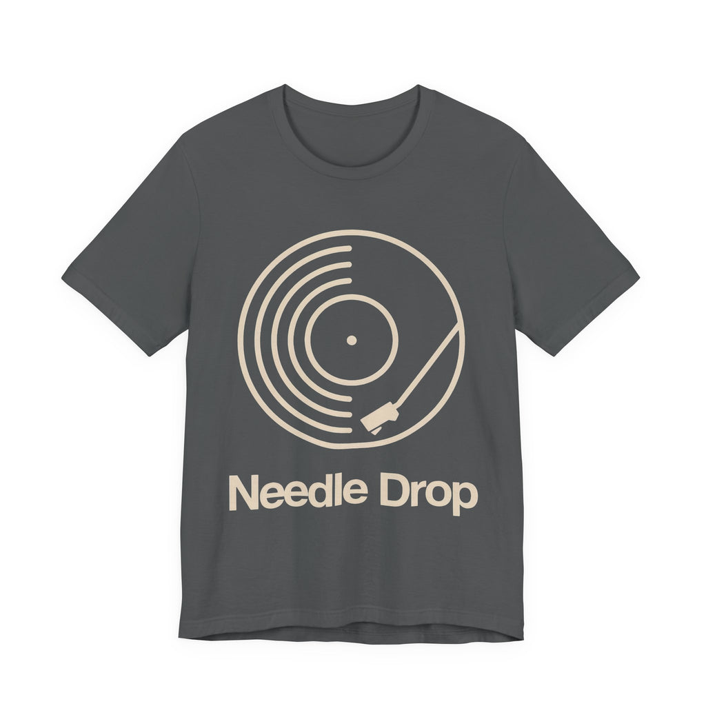 Gray t-shirt with 'Needle Drop' graphic design on a white background