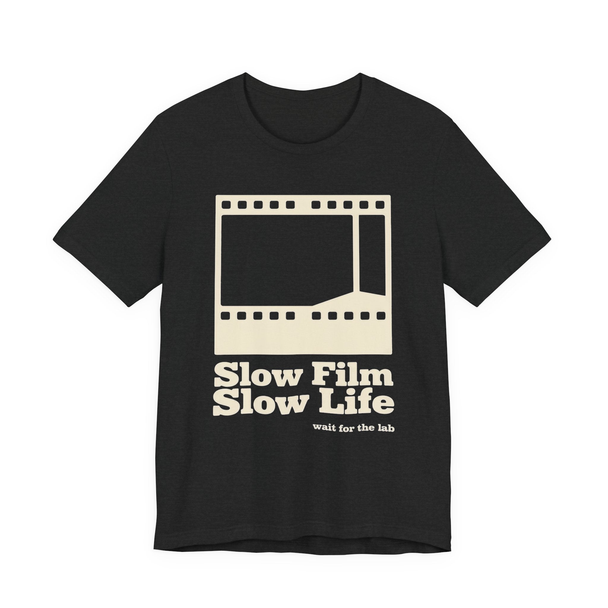 Black t-shirt with a film strip graphic and text 'Slow Film Slow Life' on a white background