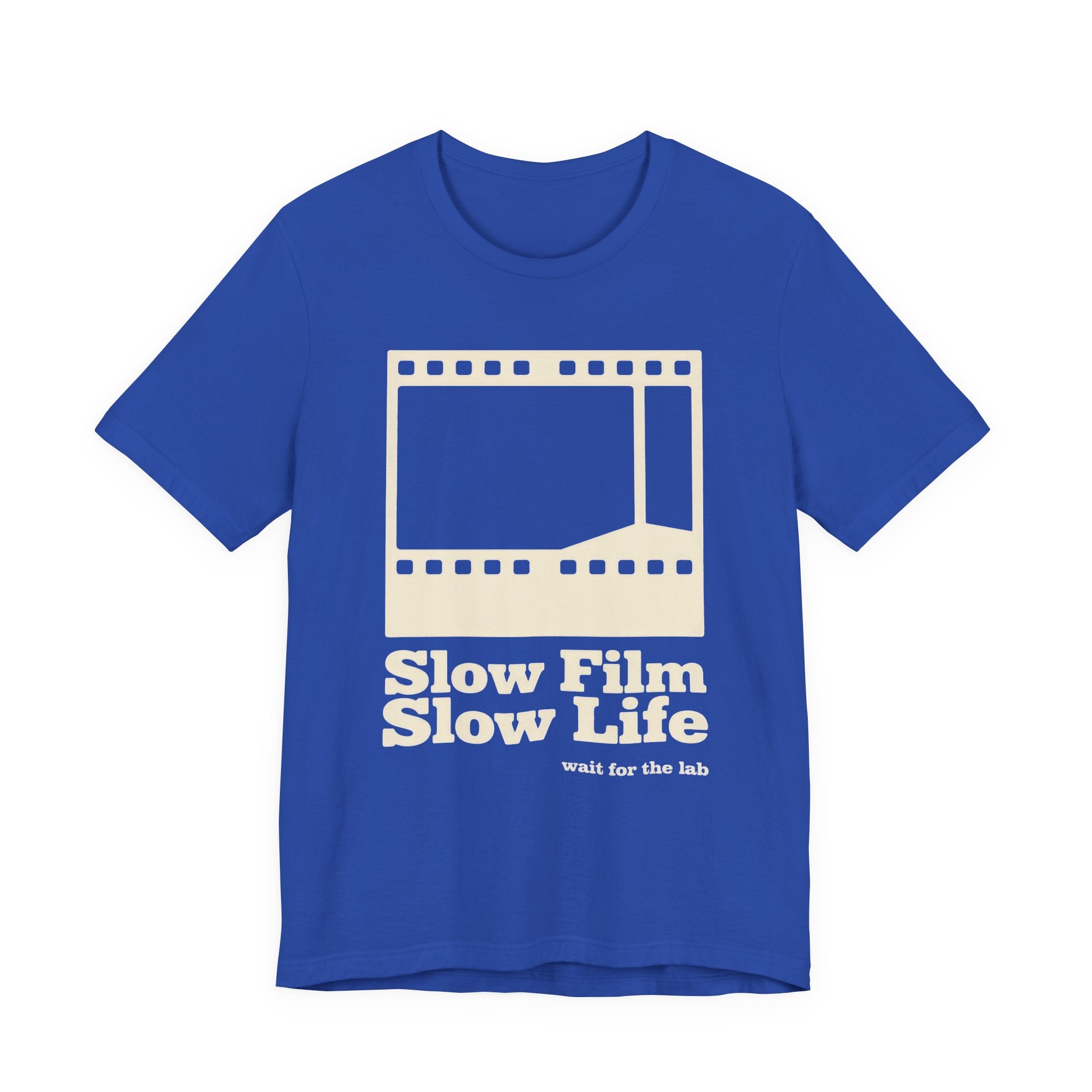 Blue t-shirt with a film strip graphic and text 'Slow Film Slow Life' on a white background
