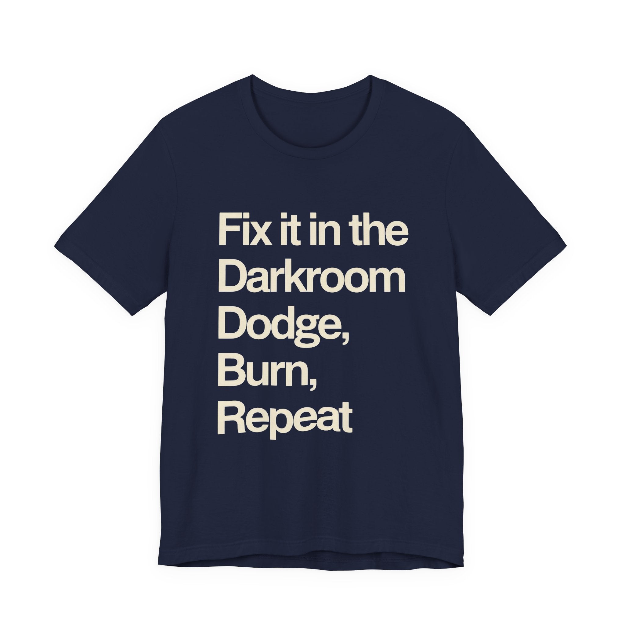 Navy t-shirt with white text 'Fix it in the Darkroom Dodge, Burn, Repeat' on a white background