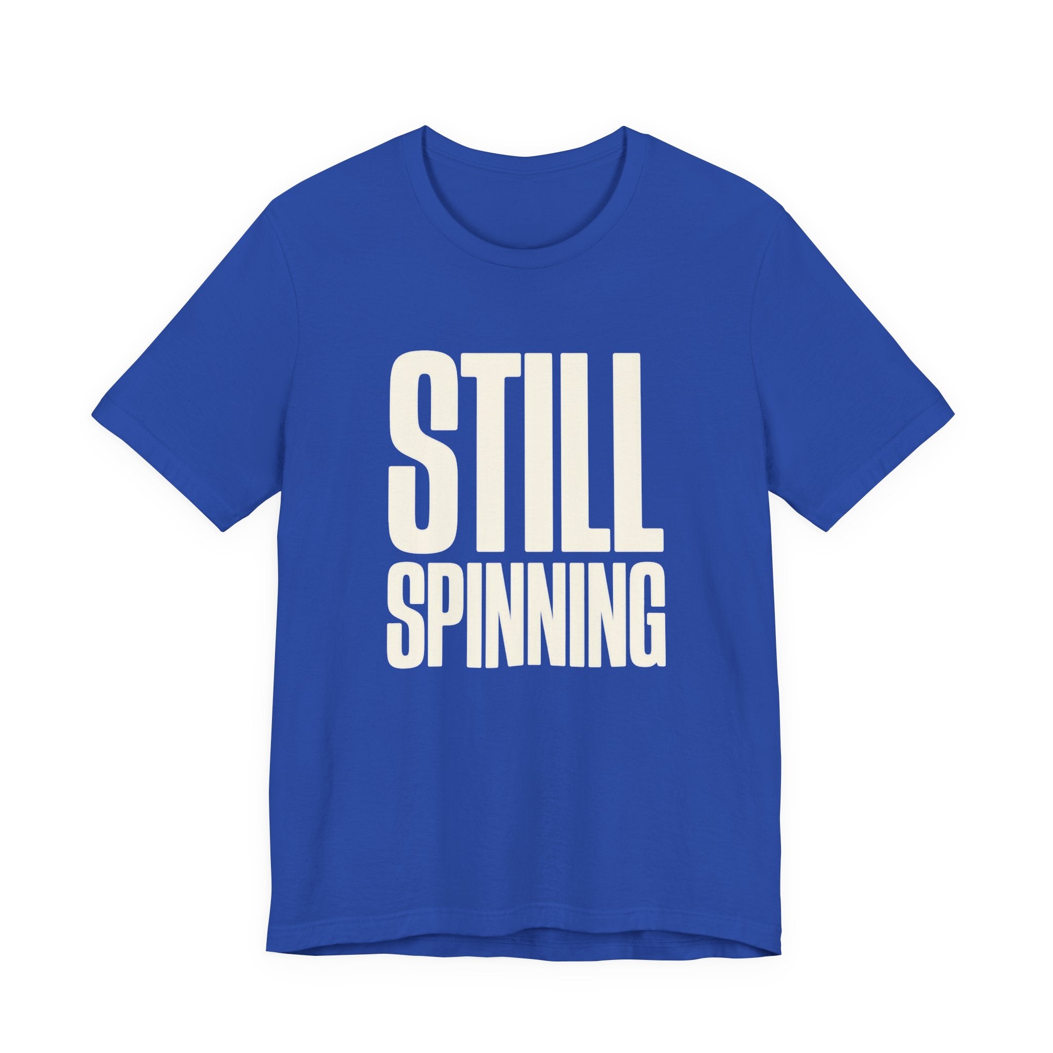 Blue t-shirt with 'STILL SPINNING' text on a white background