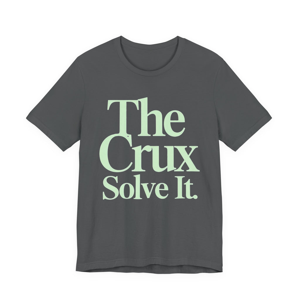 Gray t-shirt with 'The Crux Solve It' text in green on a white background