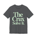 Gray t-shirt with 'The Crux Solve It' text in green on a white background