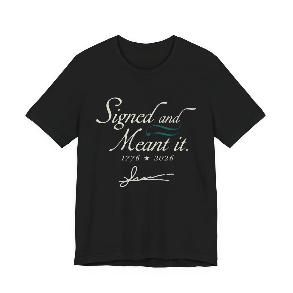Black t-shirt with white text 'Signed and Meant it. 1776 * 2026' 