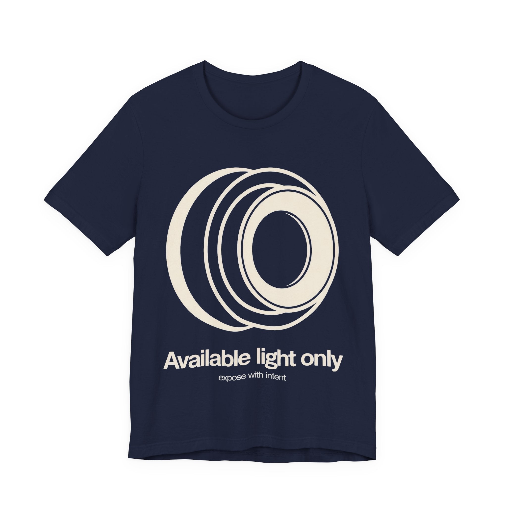Navy t-shirt with white camera lens graphic and text 'Available light only' on a white background