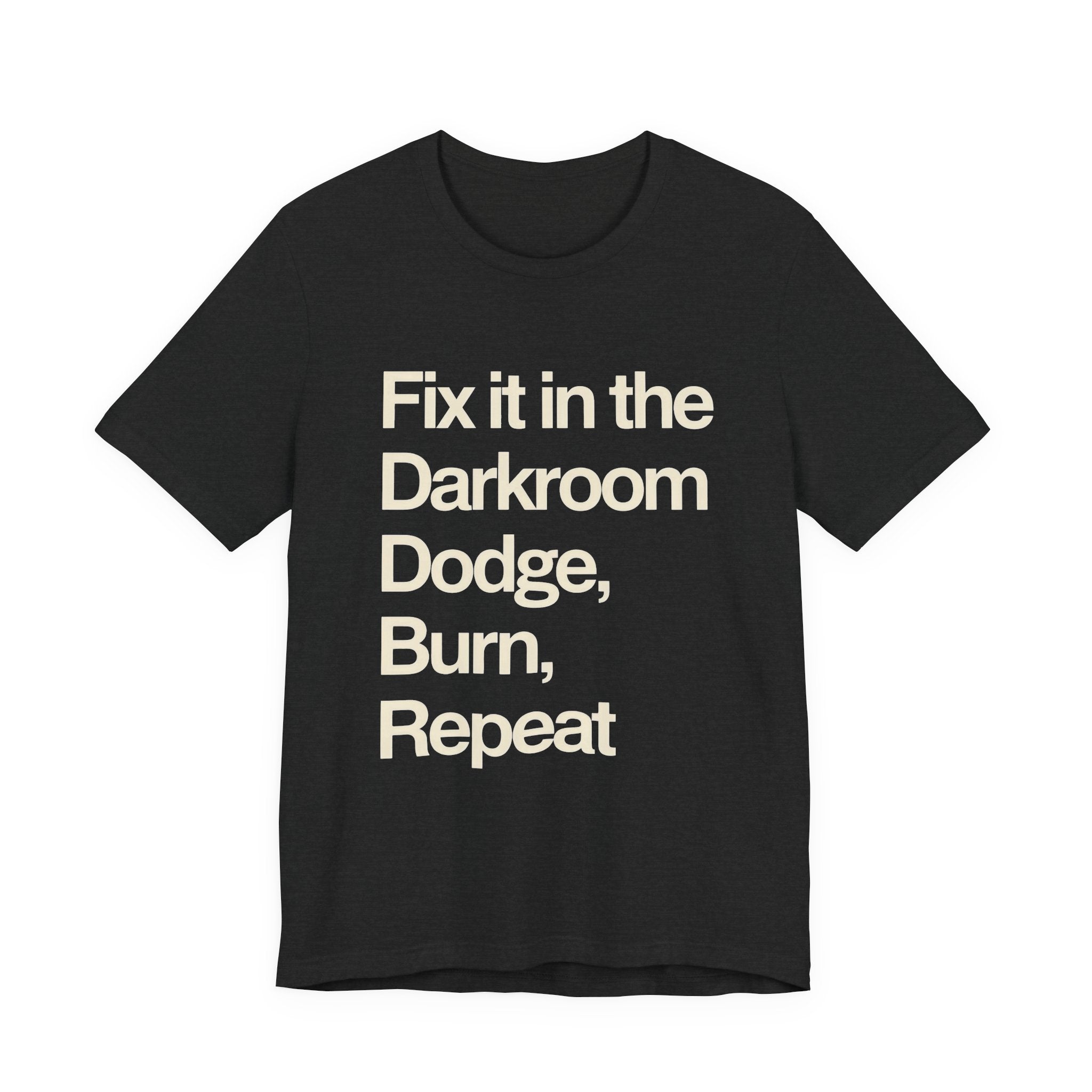 Black t-shirt with white text 'Fix it in the Darkroom Dodge, Burn, Repeat' on a white background