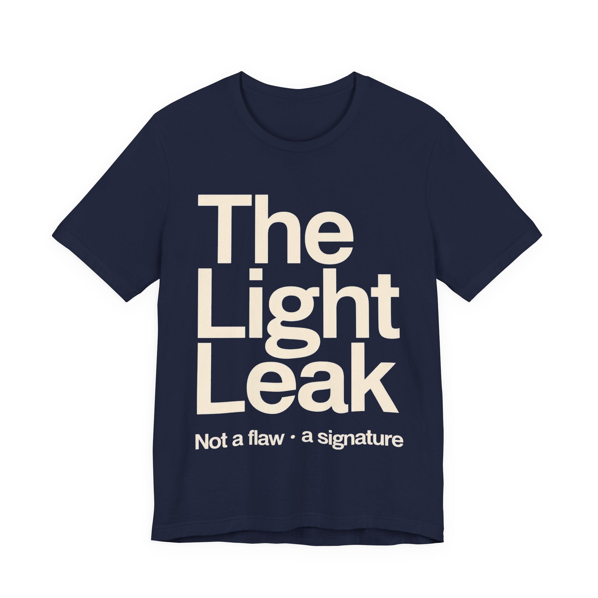 Navy t-shirt with 'The Light Leak Not a flaw, a signature' text on a white background