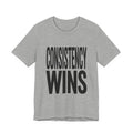 Gray t-shirt with 'CONSISTENCY WINS' text on a white background