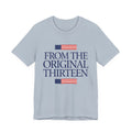 Light blue t-shirt with American flag graphics and text