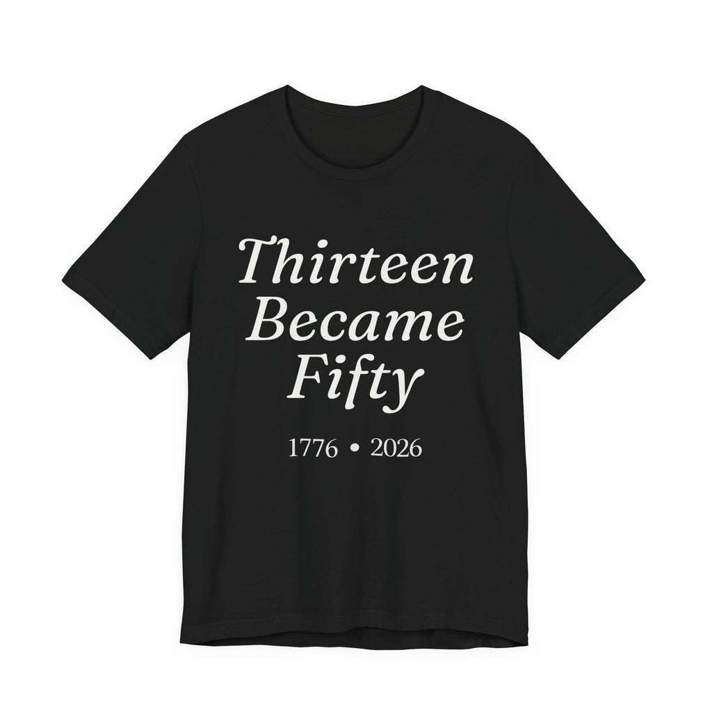 Black t-shirt with white text 'Thirteen Became Fifty 1776 • 2026' 