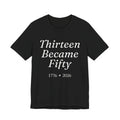 Black t-shirt with white text 'Thirteen Became Fifty 1776 • 2026' 