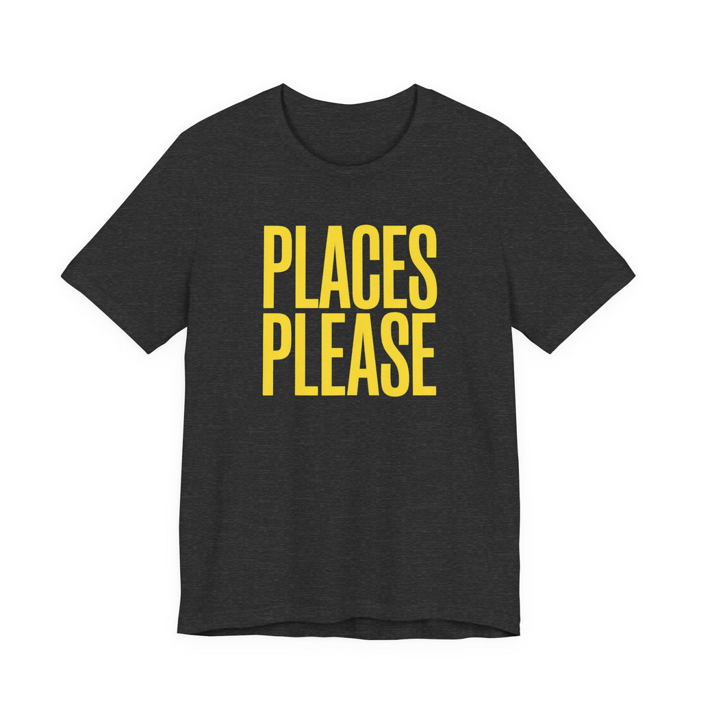 Black t-shirt with yellow text 'PLACES PLEASE' on a white background