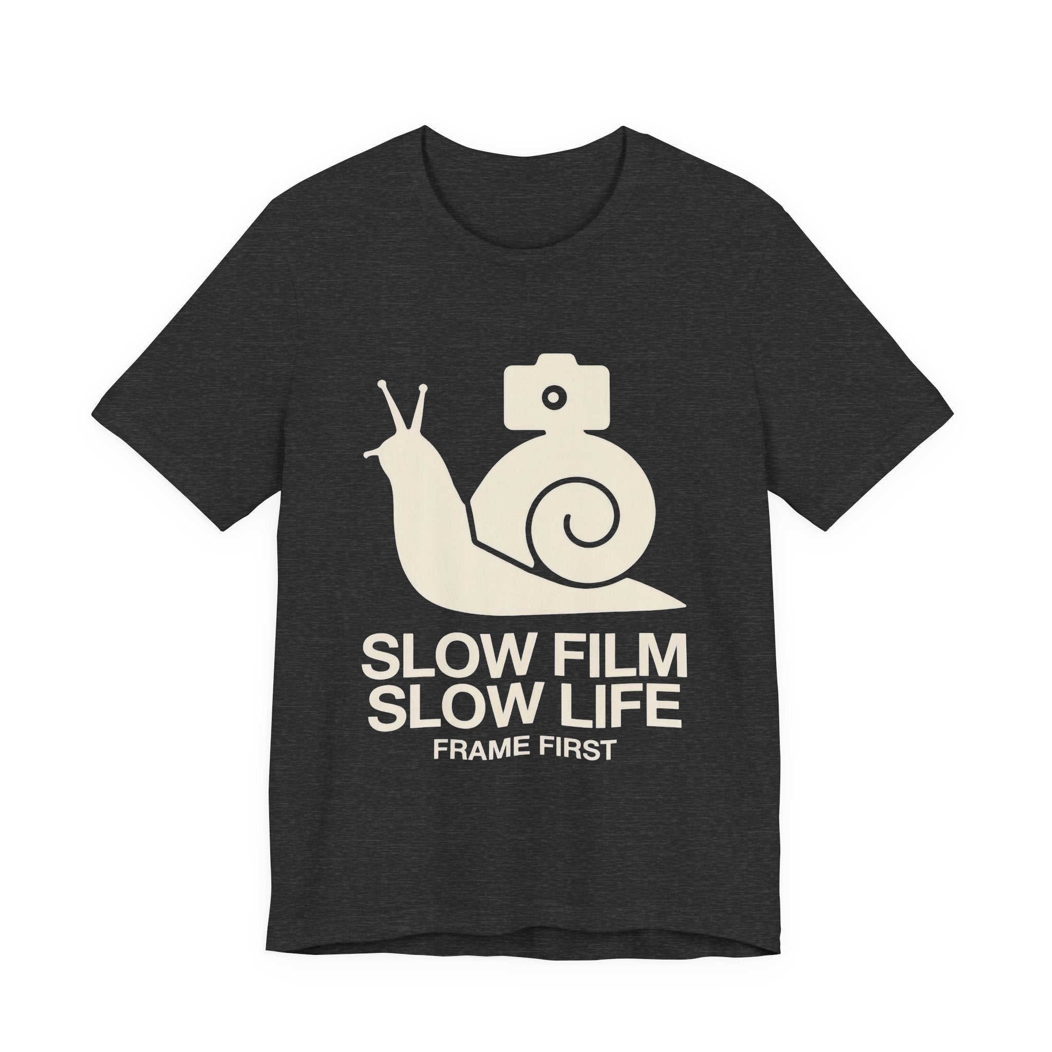 Black t-shirt with a snail and camera graphic and text 'Slow Film Slow Life Frame First' on a white background