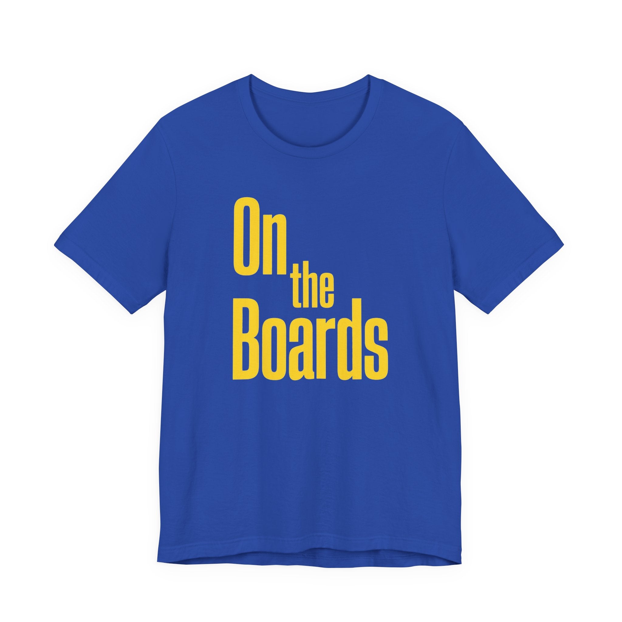 Blue t-shirt with 'On the Boards' text in yellow on a white background