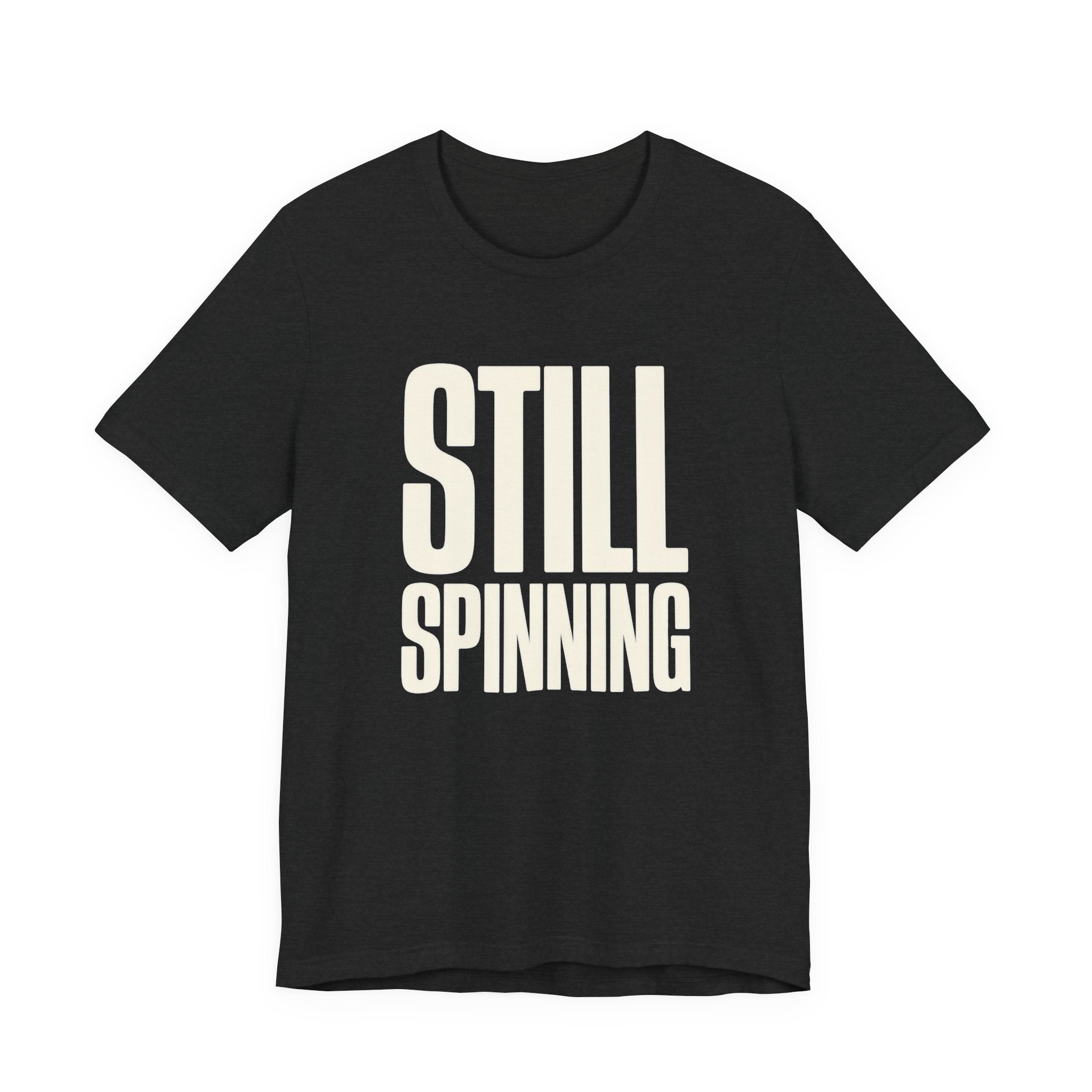 Black t-shirt with 'STILL SPINNING' text on a white background