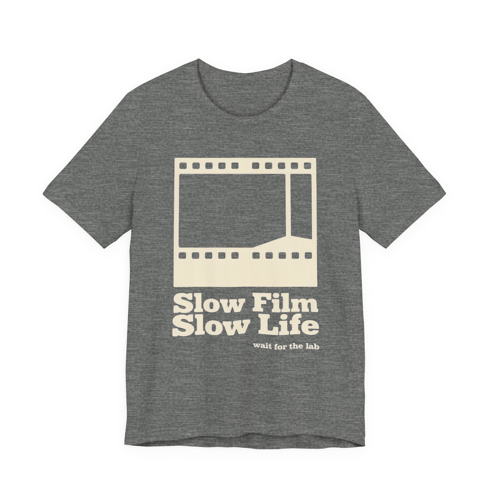 Gray t-shirt with a film strip graphic and text 'Slow Film Slow Life' on a white background