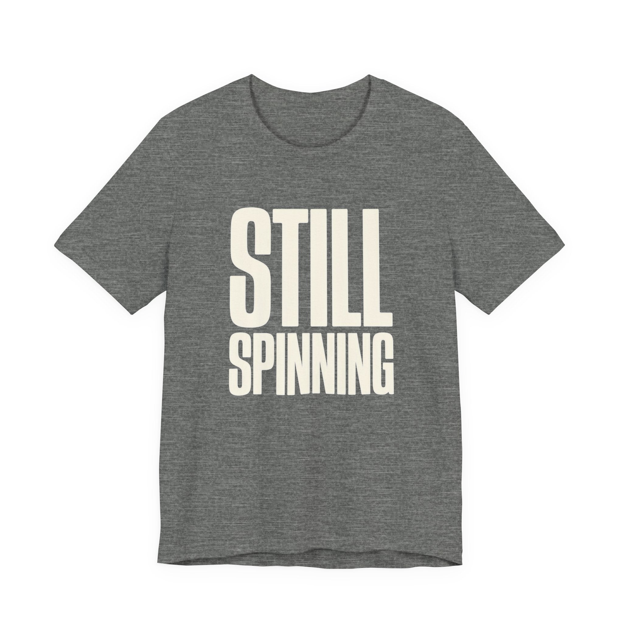 Gray t-shirt with 'STILL SPINNING' text on a white background