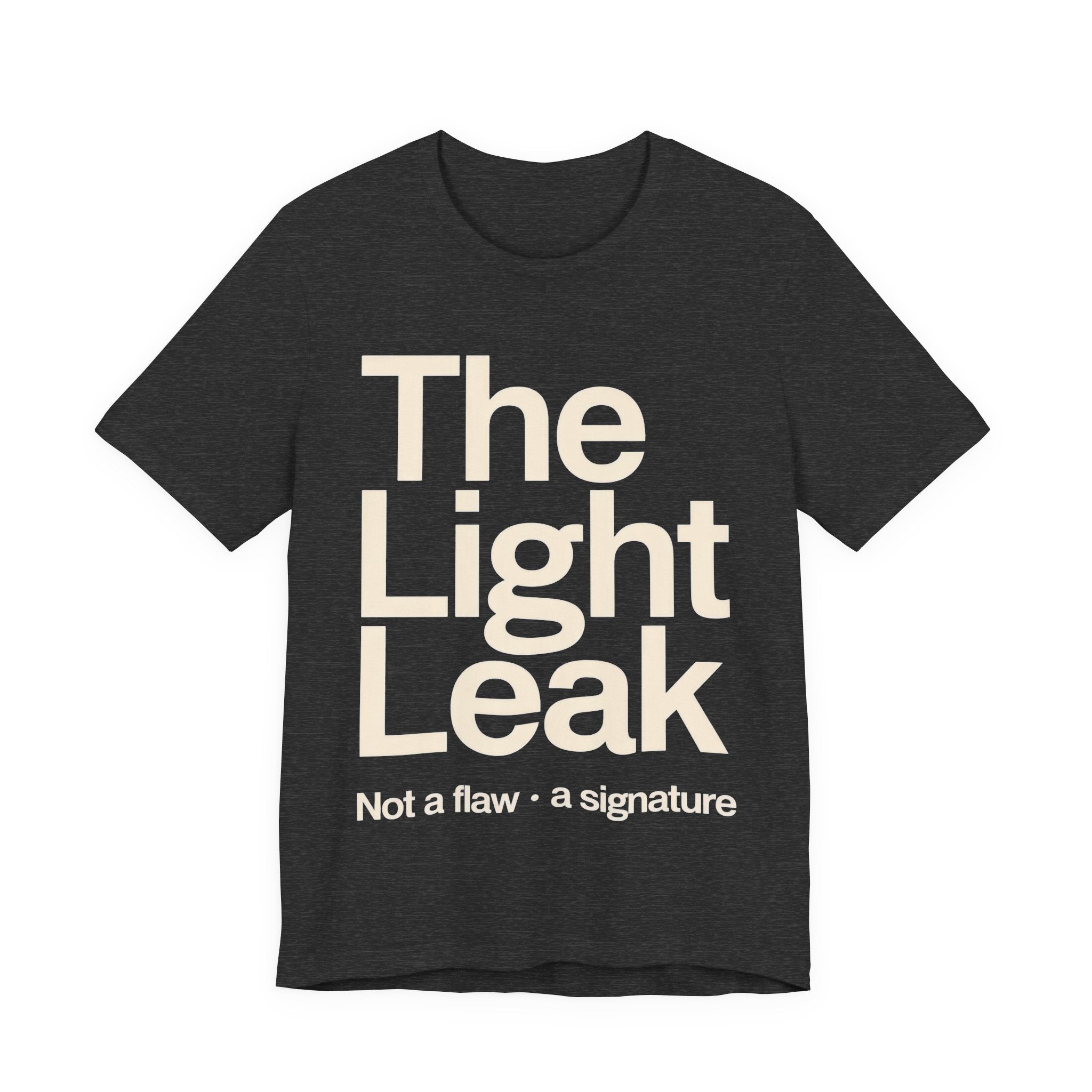 Dark grey t-shirt with 'The Light Leak Not a flaw, a signature' text on a white background
