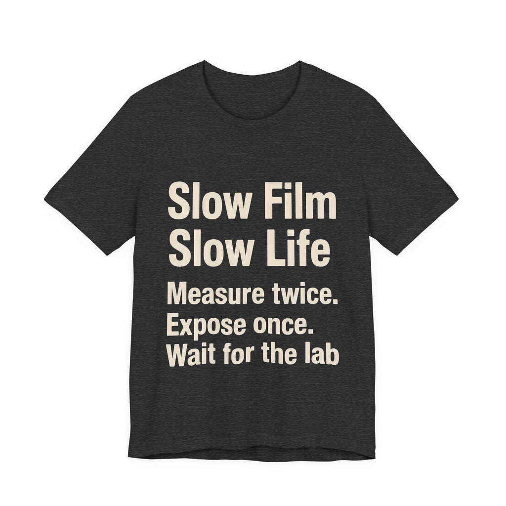 Black t-shirt with white 'SLOW FILM SLOW LIFE' text on a white background