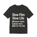 Black t-shirt with white 'SLOW FILM SLOW LIFE' text on a white background