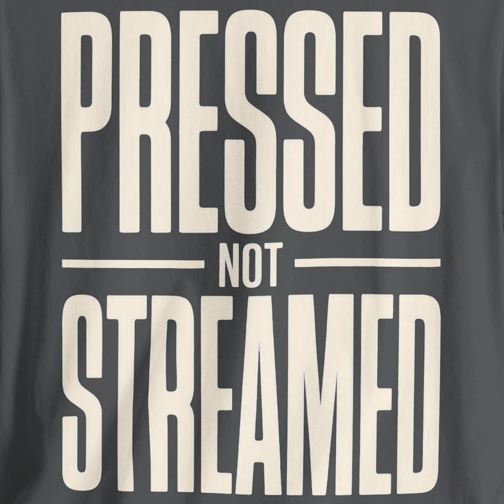 Text 'Pressed Not Streamed' on a dark background