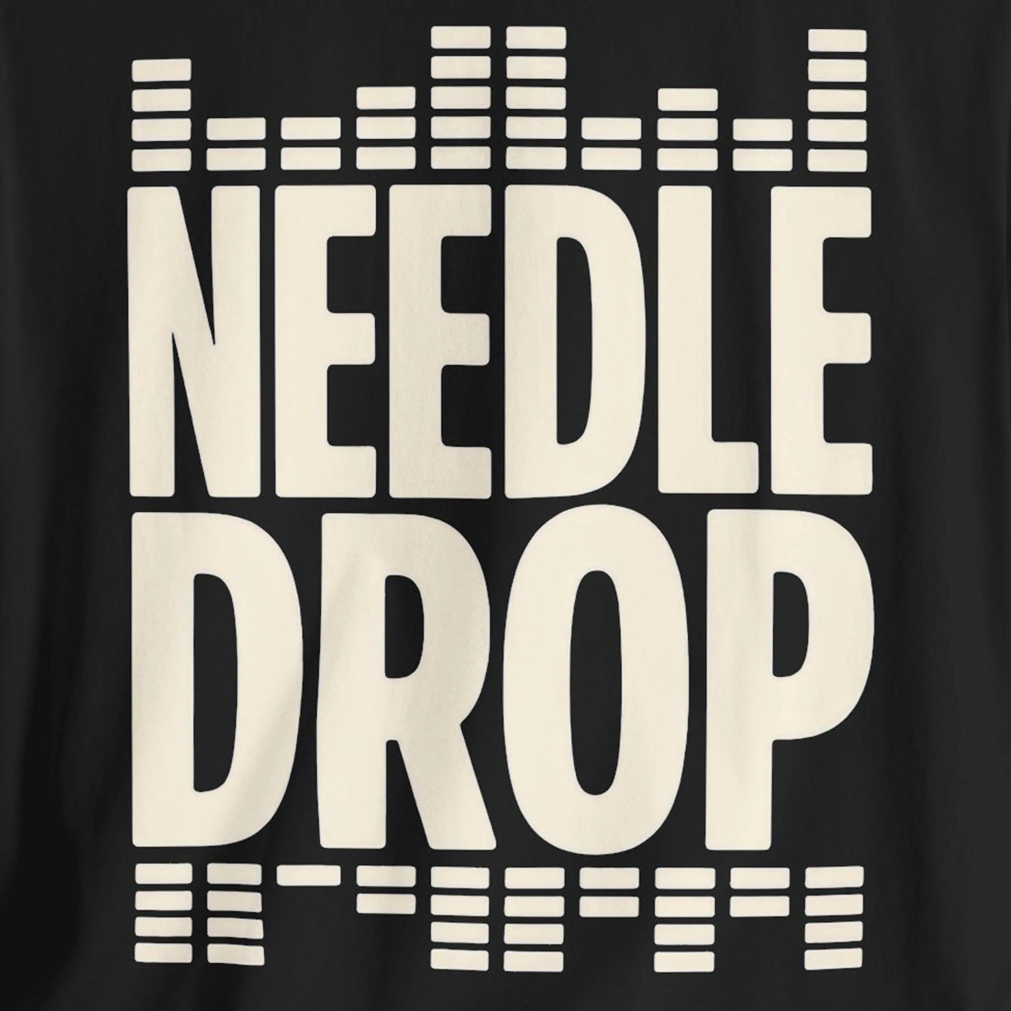 Black t-shirt with 'NEEDLE DROP' text in white on a black background