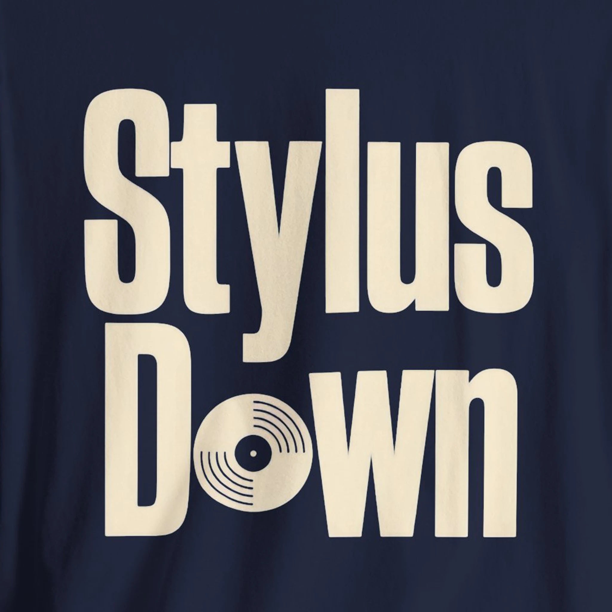 Navy blue shirt with 'Stylus Down' text in beige on a dark background