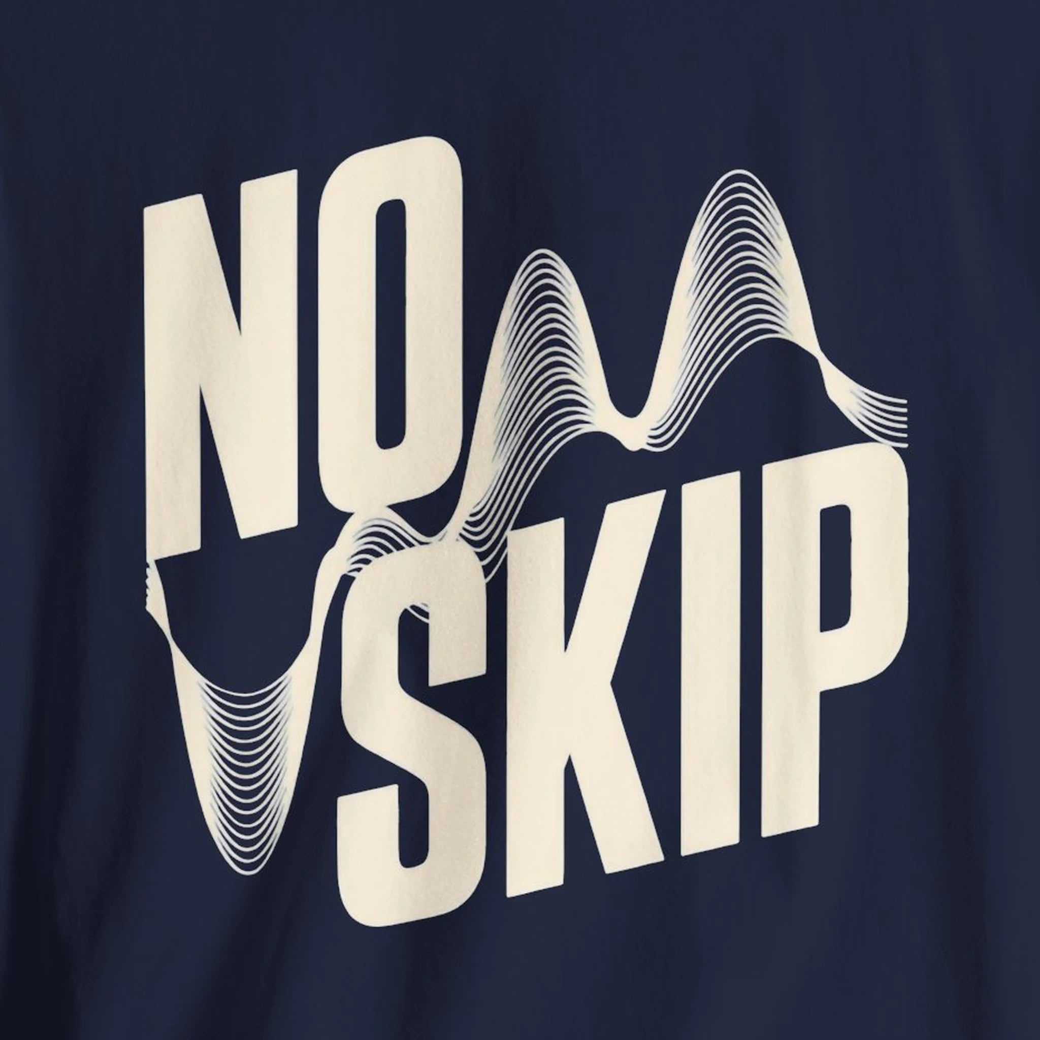 Navy blue shirt with 'NO SKIP' text design on a dark background
