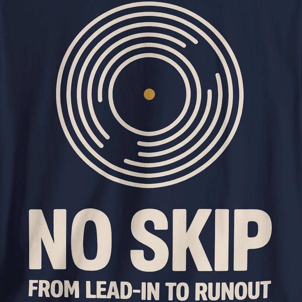 Navy blue shirt with white circular design and 'No Skip' text on a dark background