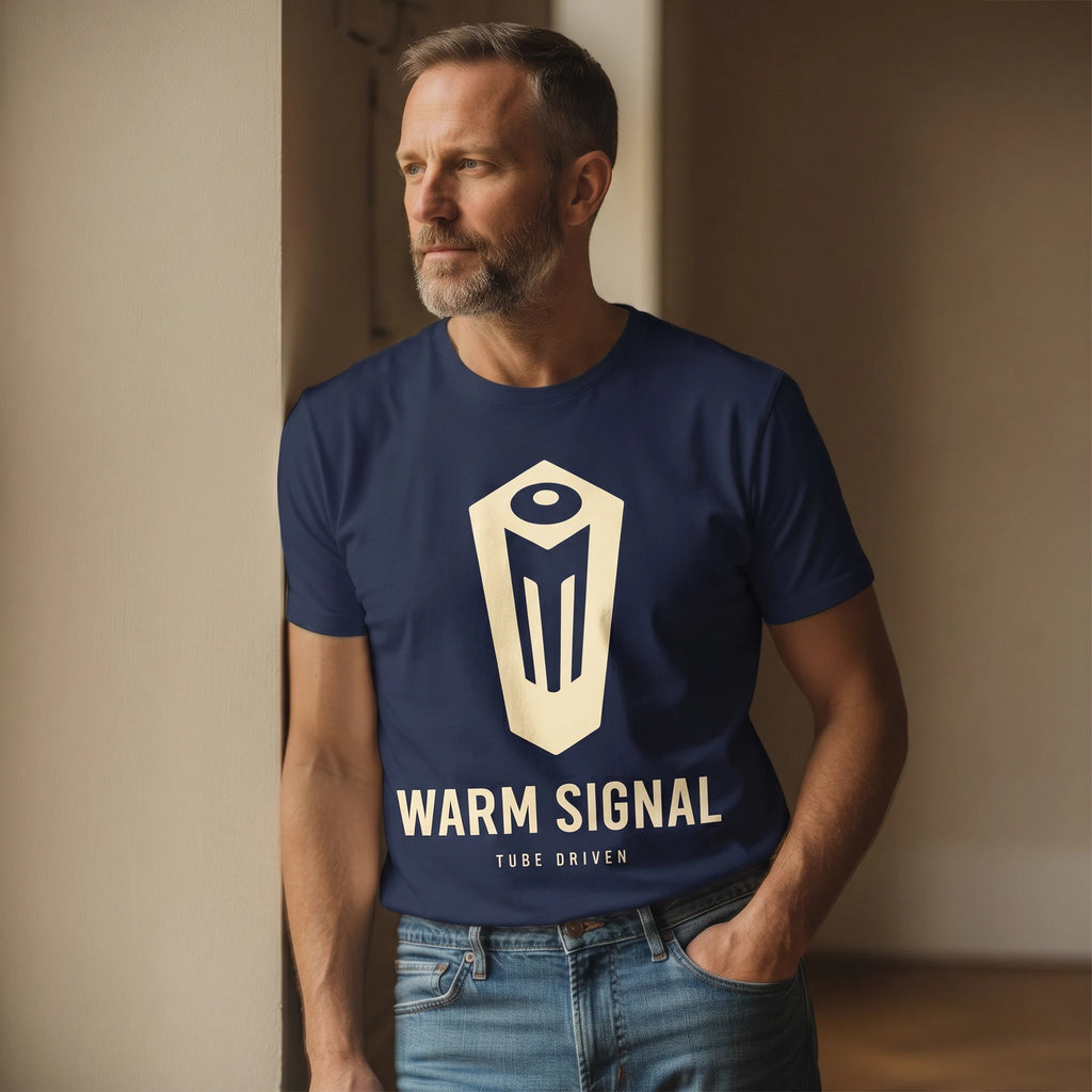 Man wearing a navy blue t-shirt with 'Warm Signal' logo and text, standing against a neutral wall.